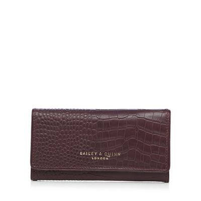 Dark red croc-effect flap over large leather purse